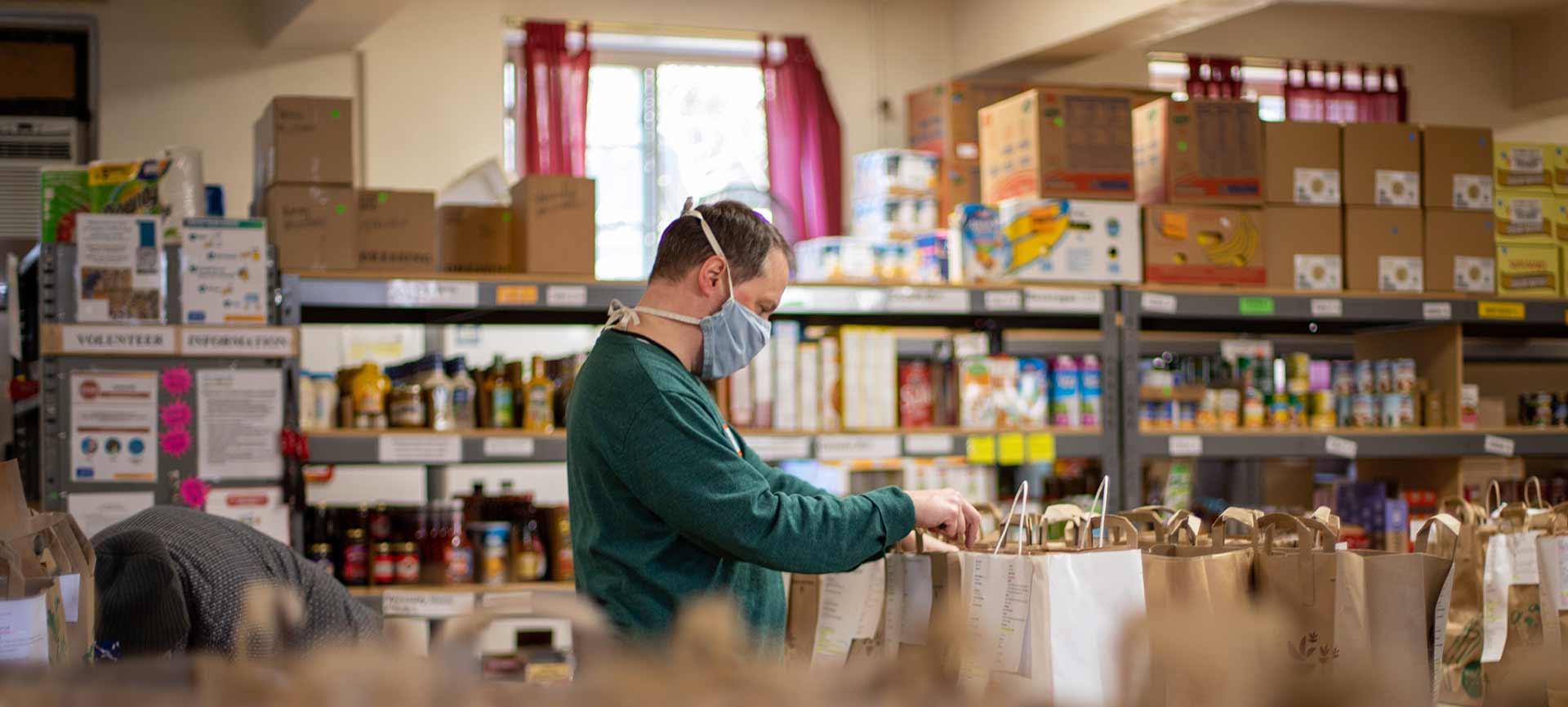 Man volunteering at food bank