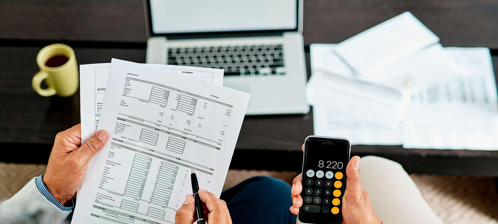 two people checking bank statements