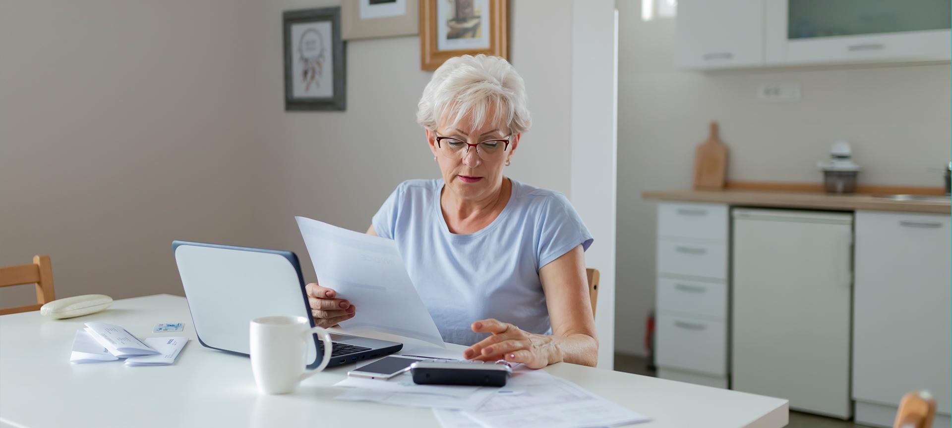 Woman using computer to check her finances