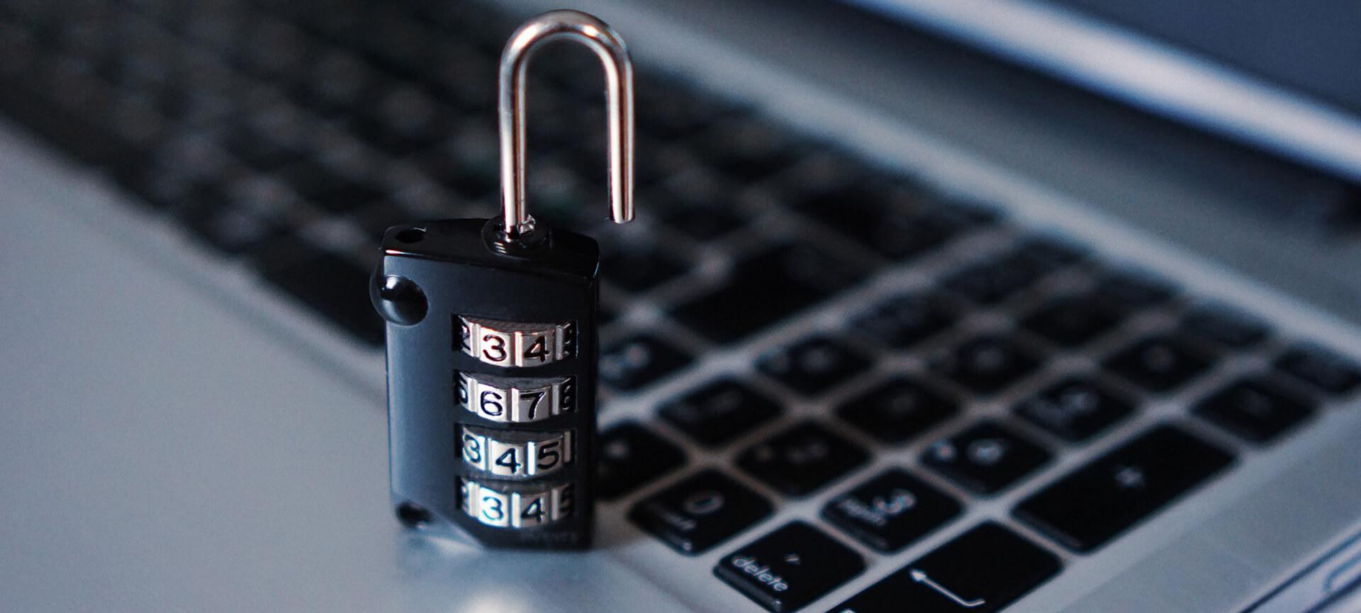 Padlock sitting on a laptop keyboard