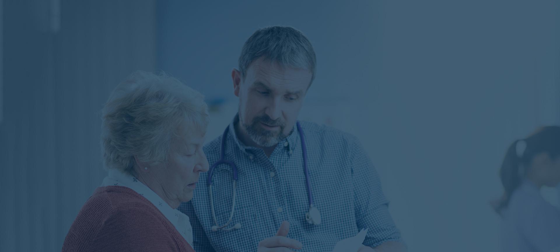 Doctor talking to older woman