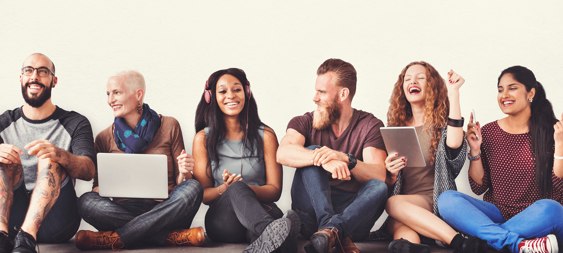 Group of people sitting using technology