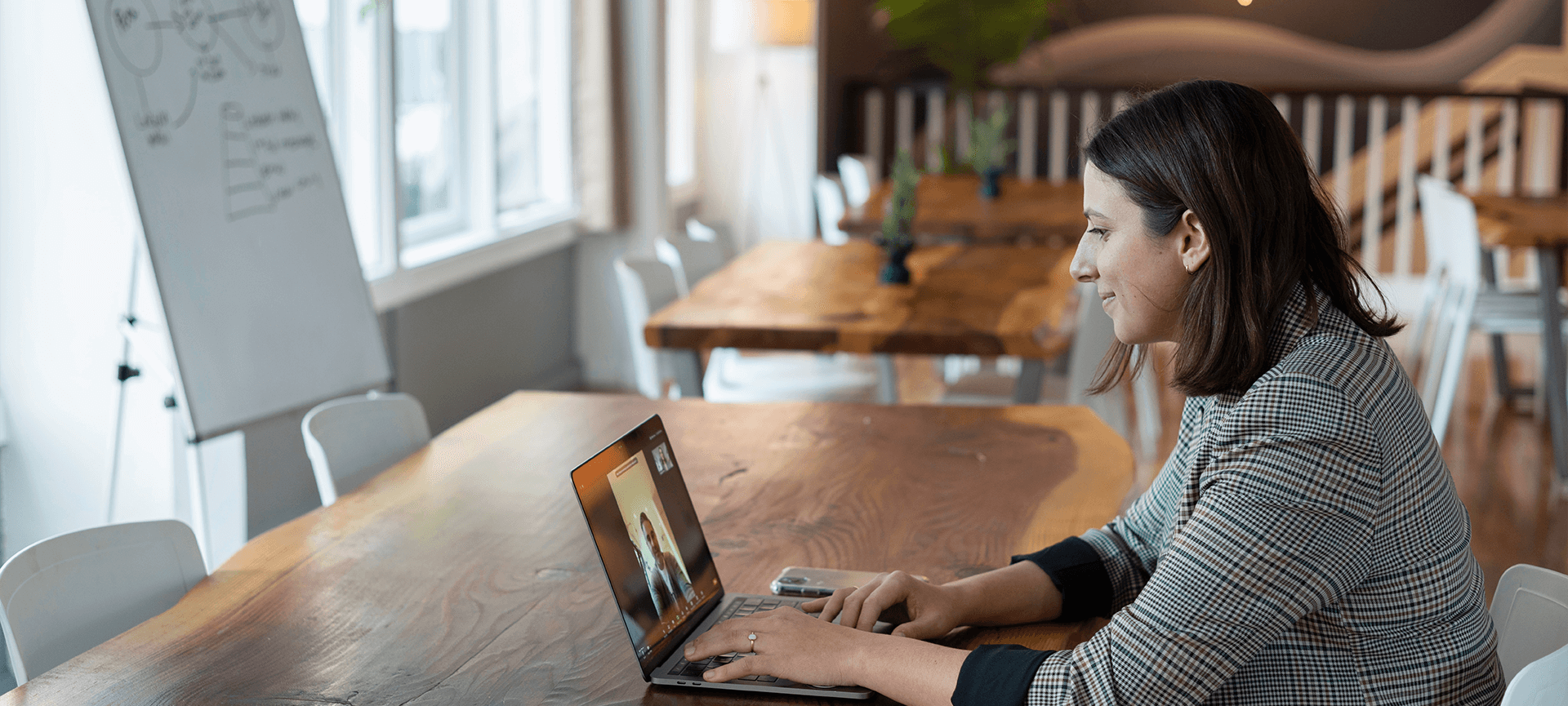 Woman online meeting at a table