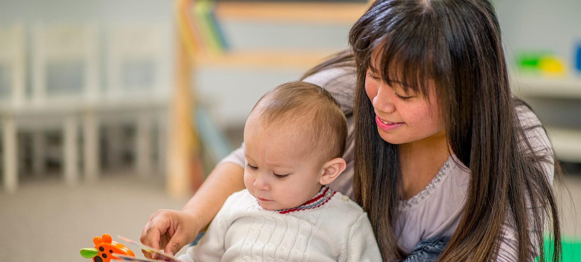 Mother reading to baby