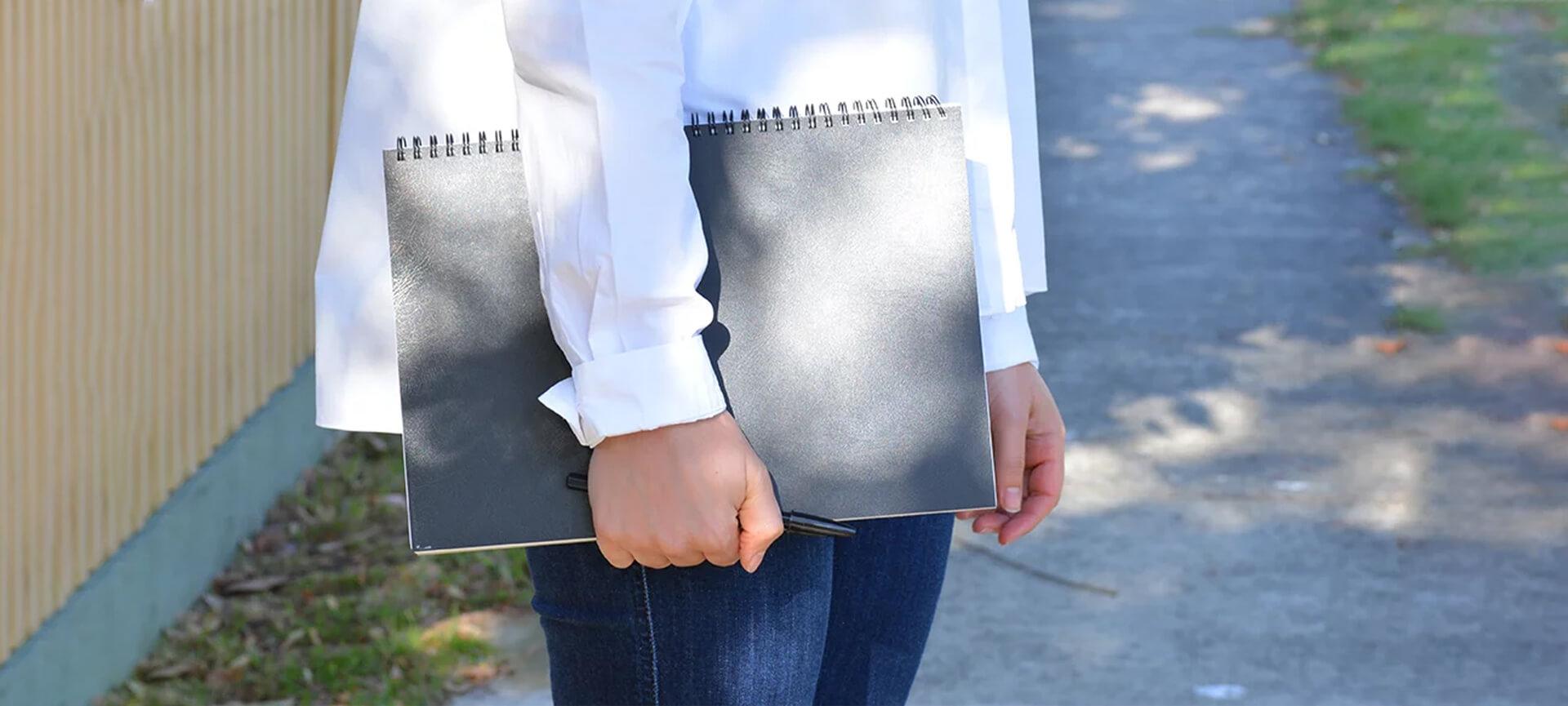 Woman holding notebook