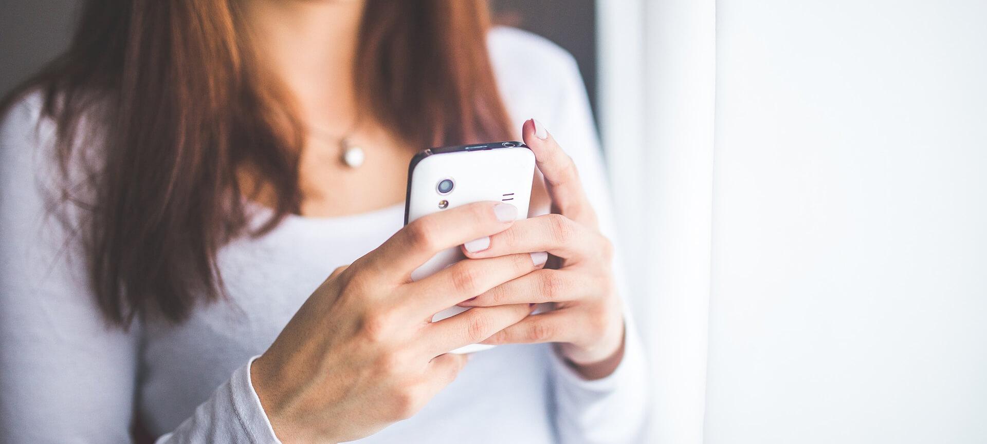 Close up of woman holding phone