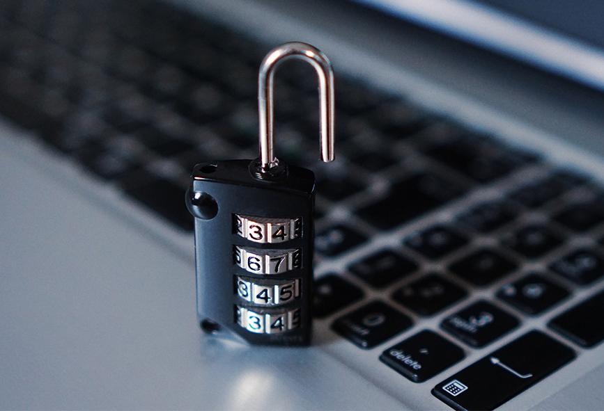Padlock sitting on laptop keyboard