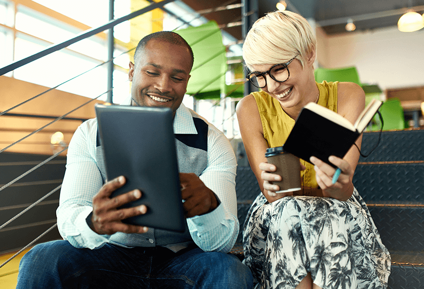 Two workers looking at a tablet computer