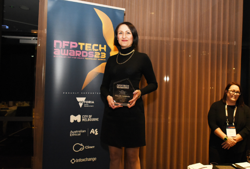 Hayley Allen accepts an award for Best Social Media Campaign at the 2023 NFP Tech Awards