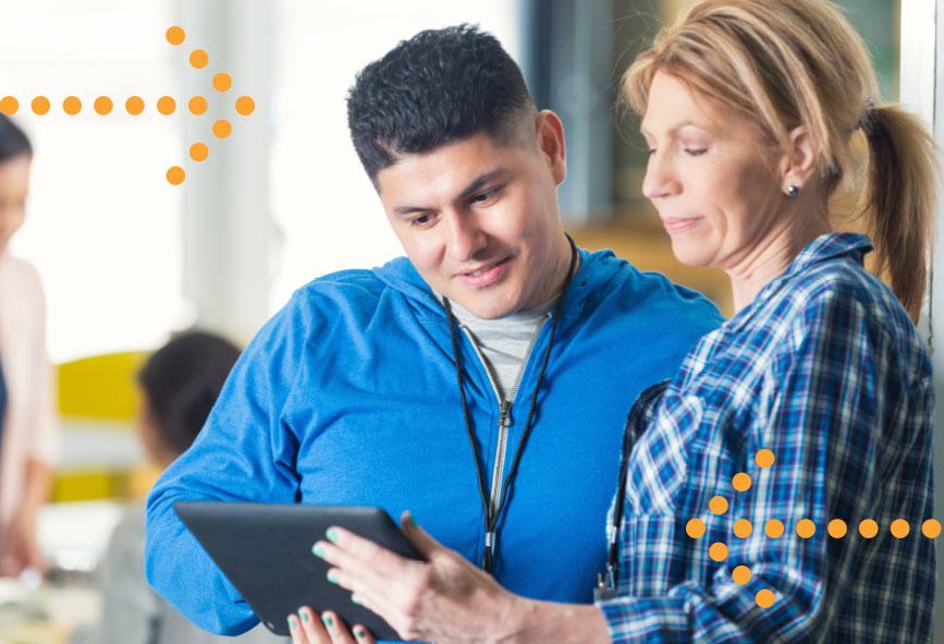 two people looking at a tablet