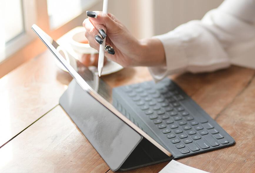 Woman working from home with tablet