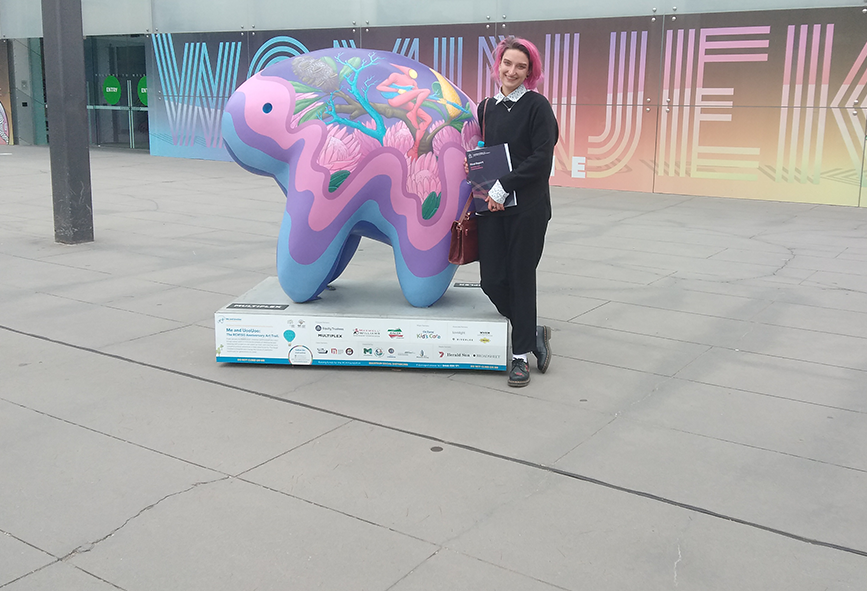 Nic standing next to a UooUoo sculpture outside Melbourne Museum