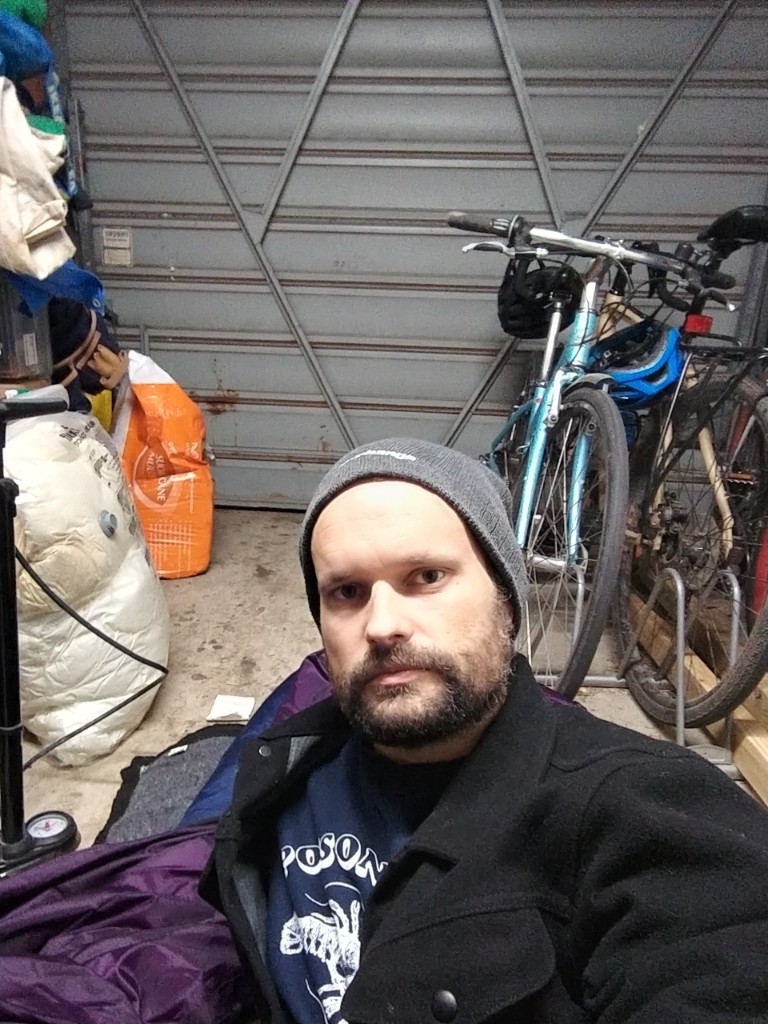 Ask Izzy Product Manger, Ben Shaw, camping out in his garage Ask Izzy Product Manger, Ben Shaw, camping out in his garage