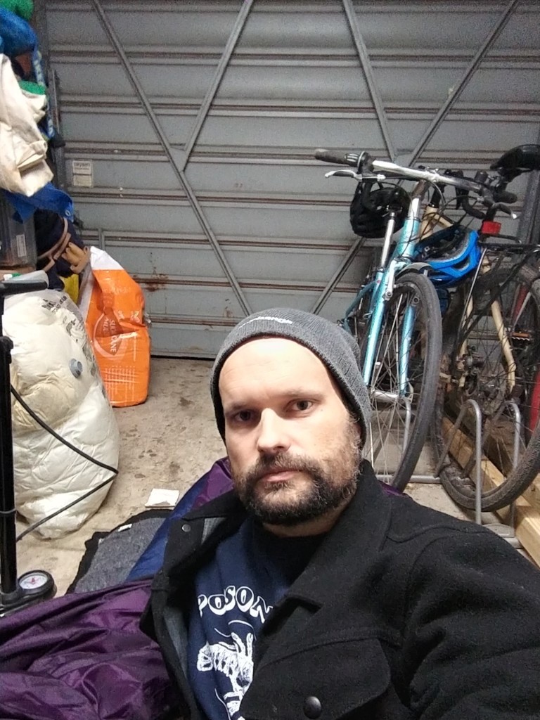 Ask Izzy Product Manger, Ben Shaw, camping out in his garage