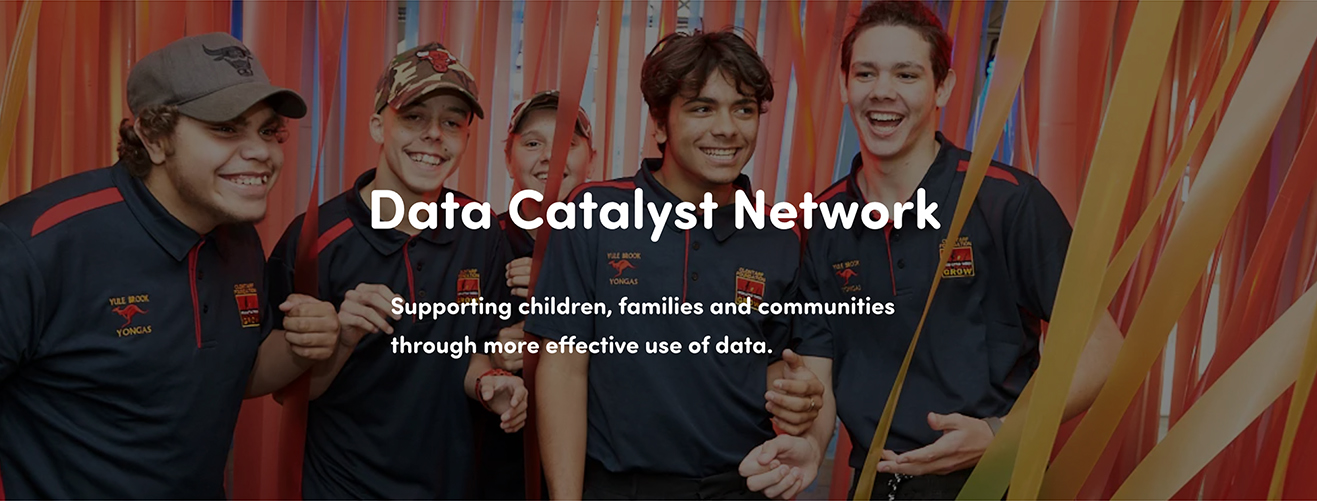An image of the Data Catalyst Network – young men in front of bright streamers.